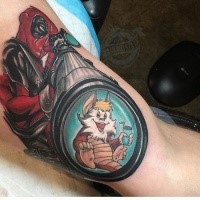 Cartoon style colored biceps tattoo of Dead pool with rifle