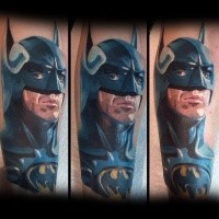 Cartoon style colored detailed Batman tattoo on arm