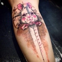 cartoon style colored forearm tattoo of sweet looking rabbit with bow
