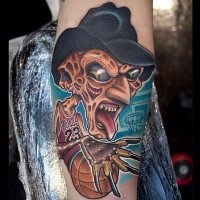 Cartoon style colored forearm tattoo of Freddy Kruger