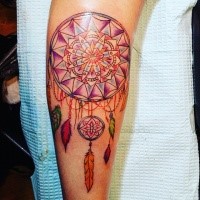 Cartoon style colored forearm tattoo of dream catcher