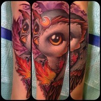 Cartoon style colored funny owl tattoo on forearm