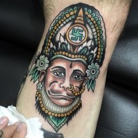 Cartoon style colored leg tattoo of monkey with incredible helmet