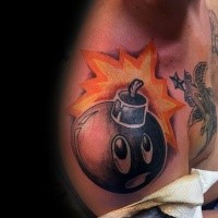 Cartoon style colored shoulder tattoo of funny bomb