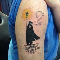 Cartoon style colored shoulder tattoo of lonely person with lettering
