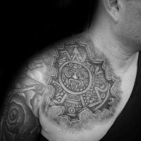 Cartoon style colored shoulder tattoo of ancient Aztec sculpture