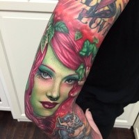 Cartoon style colored sleeve tattoo of woman with lettering