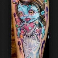 Cartoon style colored tattoo of doll with needles