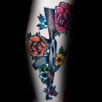 Cartoon style colored tattoo of various flowers and AK rifle