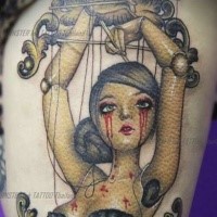 Cartoon style colored thigh tattoo female puppet