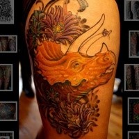 Cartoon style colored thigh tattoo of dinosaur head with flowers