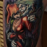 Cartoon style colored thigh tattoo of Joker with sexy woman