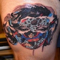 Cartoon style colored thigh tattoo of woman face with superman