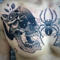 Cartoon style funny looking chest tattoo of demonic skull and spider