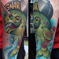 Cartoon style funny looking fish tattoo on forearm stylized with lettering