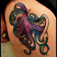 Cartoon style painted multicolored octopus tattoo on thigh