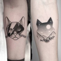 Cat shaped sot style interesting looking forearm tattoo of ornaments