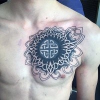 Celtic style black ink chest tattoo of big symbol