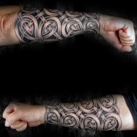 Celtic style black ink forearm tattoo of big knots