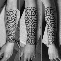 Celtic style black ink forearm tattoo of typical ornaments