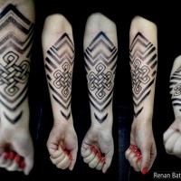 Celtic style black ink forearm tattoo of big knot with ornaments