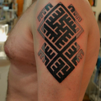 Celtic style black ink shoulder tattoo of typical ornament