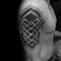 Celtic style black ink shoulder tattoo of big ornament