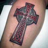 Celtic style colored leg tattoo of large ancient cross