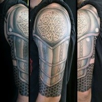 Celtic style detailed medieval armor tattoo on shoulder