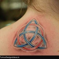 Celtic style little multicolored knot tattoo on upper back