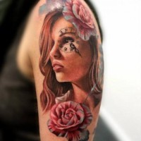 Charming young girl's portrait with clock table on eye colored shoulder tattoo in 3D style with roses