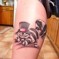 Cheshire cat in cylinder hat arm tattoo