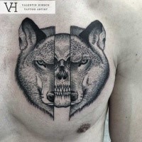 Chest tattoo designed by Valentin Hirsch of split wolf head with human skull