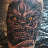 Chinese lion head tattoo on leg by graynd