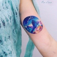 Circle shaped arm tattoo of night sky mountain with zodiac symbol