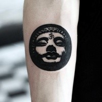 Circle shaped black ink forearm tattoo of Buddha face symbol