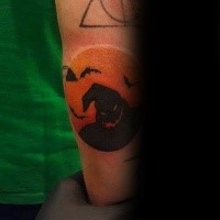 Circle shaped colored arm tattoo stylized with dark ghost and bats