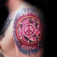 Circle shaped shoulder tattoo of diamond stylized with pacific symbol