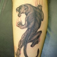 Climb up panther tattoo on leg