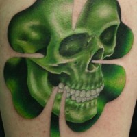 Skull in green four leaf clover tattoo