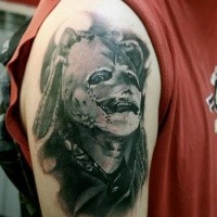Colored amazing looking shoulder tattoo of famous band singer