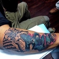 Colored arm tattoo of ancient Egypt statue with night sky