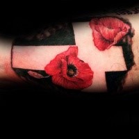 Colored arm tattoo of big white cross with flowers