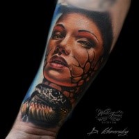 Colored awesome looking arm tattoo of woman face with snake
