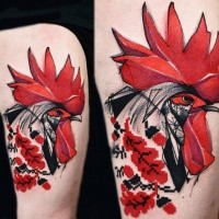 Colored beautiful looking thigh tattoo of cock head with ornaments