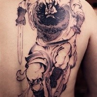 Colored black ink back tattoo of funny looking man