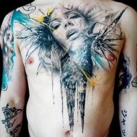 Colored chest tattoo of woman face with crow