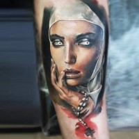 Colored creepy looking tattoo of creepy nurse with cross