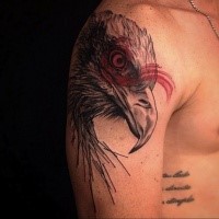 Colored engraving style shoulder tattoo of eagle head