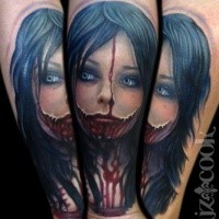 Colored forearm tattoo of bloody woman